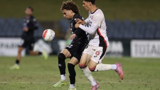Zane Helweh of the Bulls competes with Marcus Savic of the Wanderers at Campbelltown Stadium.